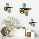 Set of 3 Ruru wall art pieces in vibrant colors on brushed silver, embodying Kiwiana culture for stylish home decor.