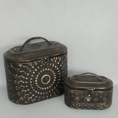 Set of 2 domed black metal boxes for stylish organization, ideal for home decor and versatile storage solutions.