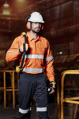 Men's orange FR Closed Front Hooped Taped Shirt, featuring flame-resistant fabric, secure closures, and ventilation for comfort.