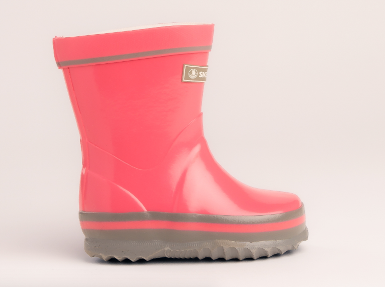 Bright pink Skellerup Junior Gumboots size 6, featuring reinforced protection and anti-microbial lining for comfort and durability.