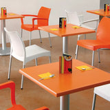 Vibrant orange Vita Chair with sleek aluminum legs, ideal for modern indoor and outdoor spaces, combining style and sustainability.