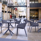 Dark grey Sky Table, 70x70cm, features a weather-resistant resin top and sturdy metallic frame for indoor/outdoor use.