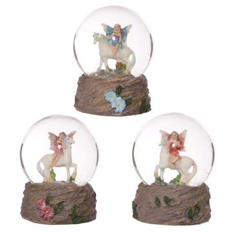 Set of 3 enchanting snow globes with fairies riding unicorns, perfect for whimsical decor and gifting.