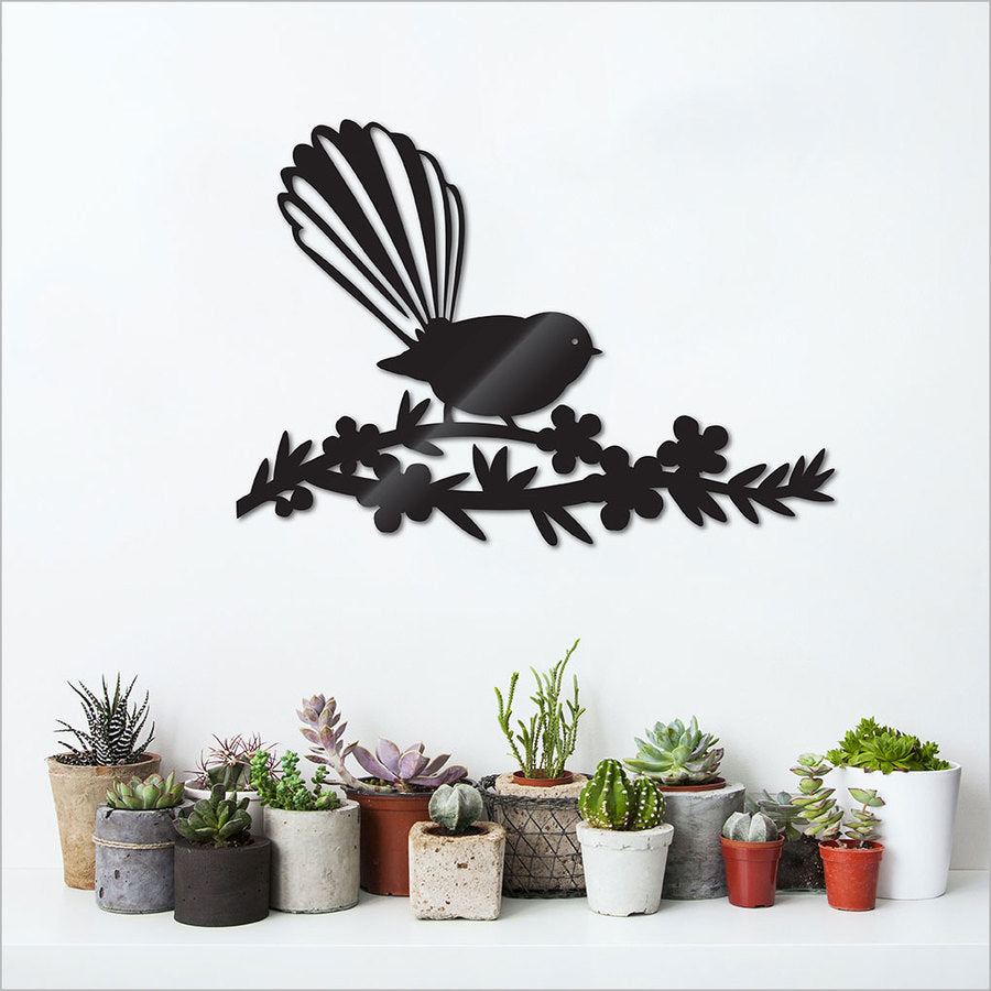 Kiwiana wall art featuring a vibrant Fantail on Manuka flowers, crafted from durable Black ACM, perfect for any space.