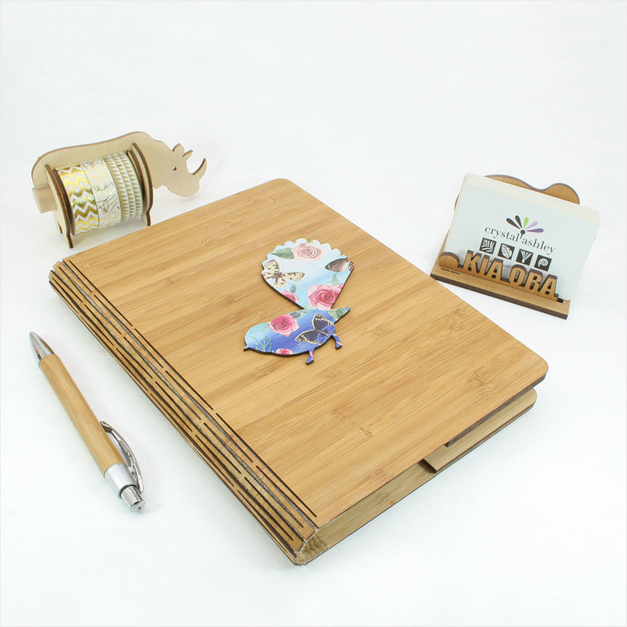 Eco-friendly Bamboo Journal featuring vibrant Kereru floral design, perfect for writing and creativity. 175mm x 230mm size.
