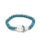 Turquoise crystal bracelet with heart charm and guardian angel, symbolizing love, strength, and positivity.