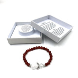 Carnelian crystal bracelet with heart guardian angel charm, symbolizing love, protection, and spiritual growth.