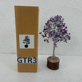 Amethyst gemstone tree, 23cm tall, featuring purple crystals and artistic branches for decor and tranquility.