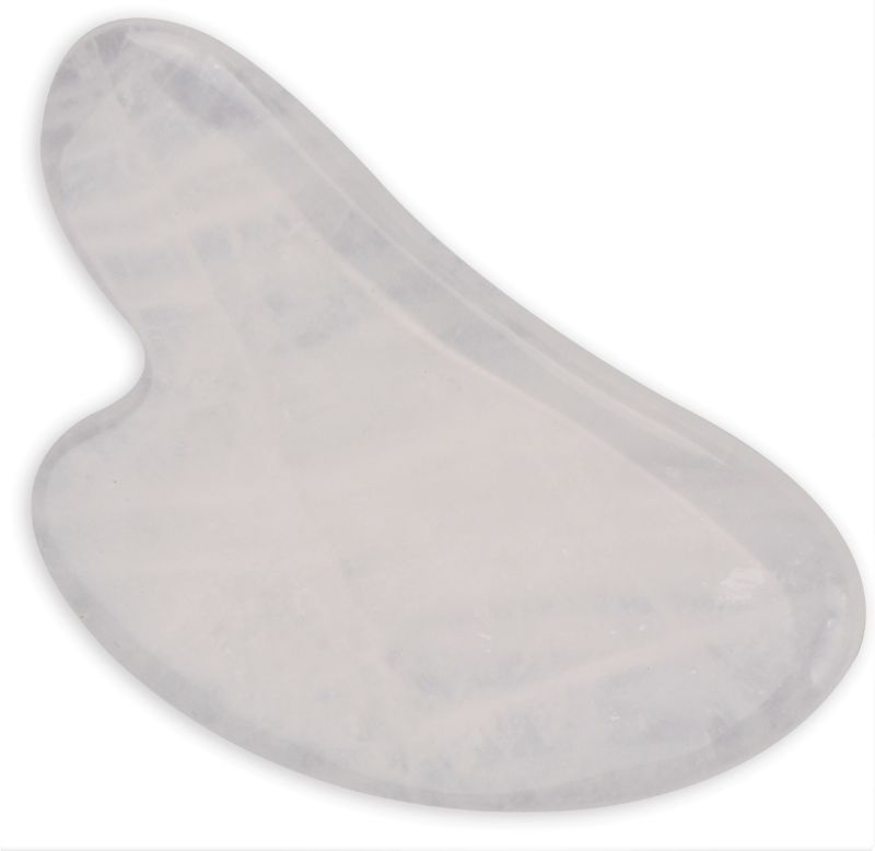 Heart-shaped Clear Quartz Gua Sha Plate (8.5cm) for facial massage, enhancing circulation and promoting skin health.