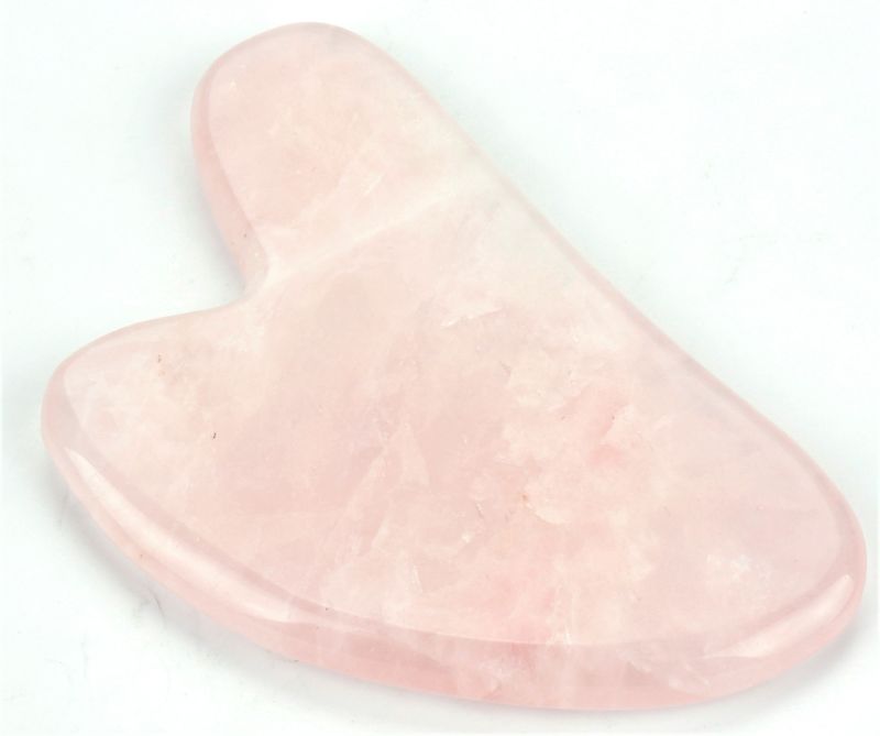 Heart-shaped Rose Quartz Gua Sha plate, 8.5cm, for facial massage, promoting circulation and enhancing natural glow.