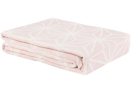 Luxurious Rose Quartz and White geo knit throw blanket, perfect for coziness and style in any living space.