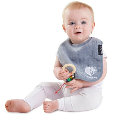 Stylish grey Kiwi-inspired bib featuring absorbent cotton and water-resistant backing, perfect for messy mealtimes.