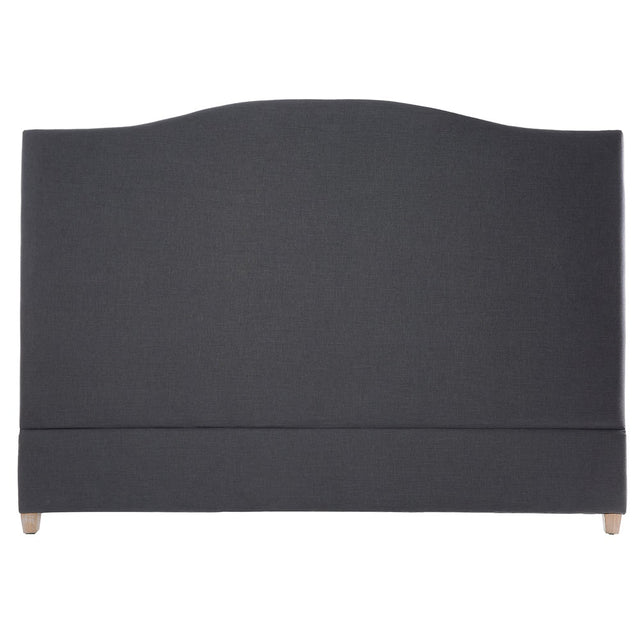 Elegant grey linen queen headboard with tufted design and copper nail head details, supported by sturdy oak legs.