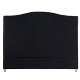 Luxurious black king headboard with tufted design, oak legs, and copper nail heads, enhancing any bedroom decor.