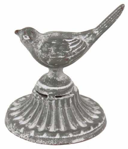 Elegant metal bird paperweight enhancing decor while organizing documents, perfect for home or office accents.
