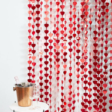 Red heart-shaped backdrop curtain for Valentine's Day celebrations, measuring 1m wide x 2.2m high, perfect for photo opportunities.