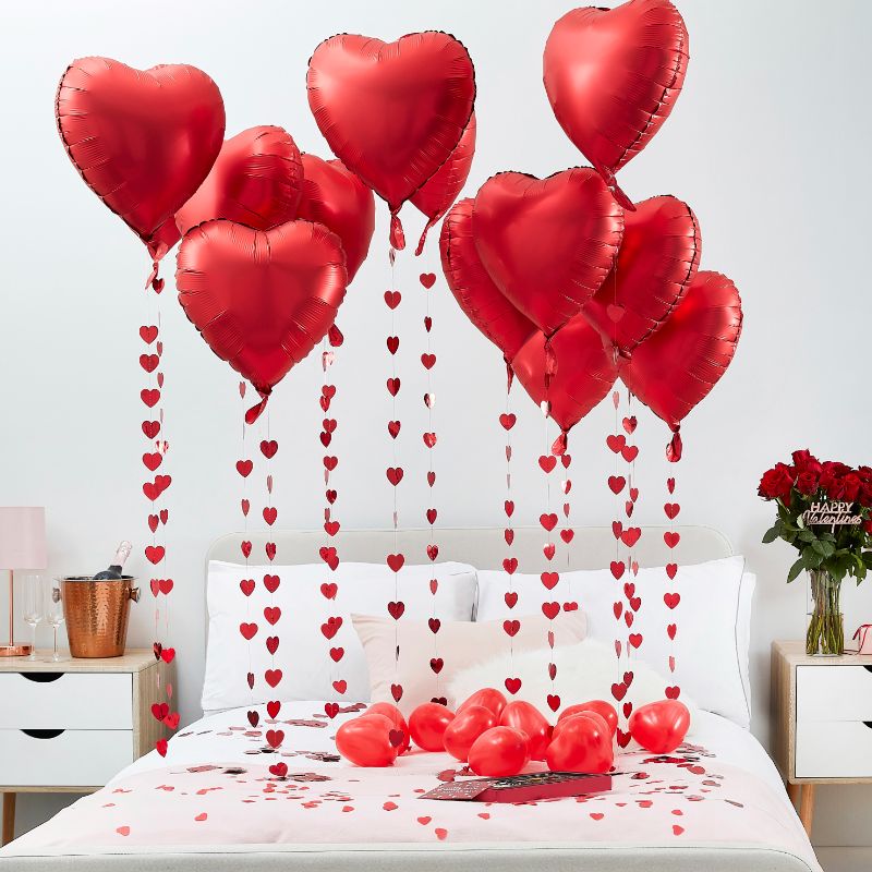 Ginger Ray heart-shaped backdrop curtain in red, ideal for Valentine's Day photo opportunities and romantic decor.