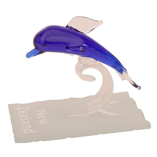 Handcrafted glass dolphin riding a wave, a stunning New Zealand souvenir in a satin-lined black presentation box.