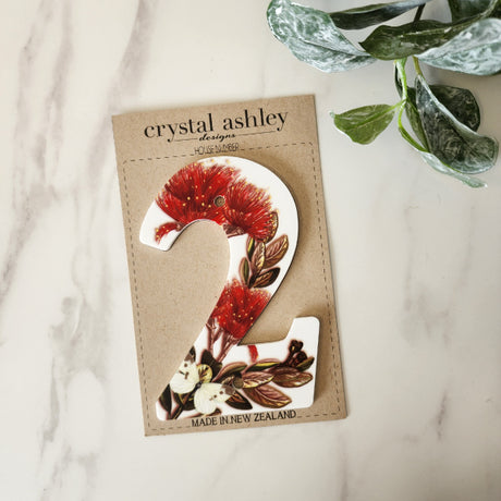 Stylish 12cm NZ Floral house number in durable white acrylic, featuring vibrant floral design for enhanced curb appeal.