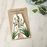 "Stylish NZ Floral A house number in 12cm white acrylic, ensuring visibility with a charming floral design for your home."