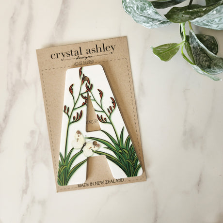 "Stylish NZ Floral A house number in 12cm white acrylic, ensuring visibility with a charming floral design for your home."