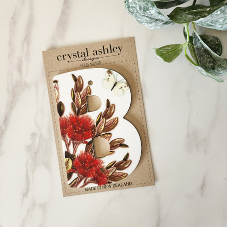 Elegant NZ Floral house number on durable white acrylic, perfect for enhancing your home's entrance with style.