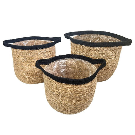 Handcrafted seagrass planters with black tops and handles, set of 3 in various sizes, lined for moisture protection.