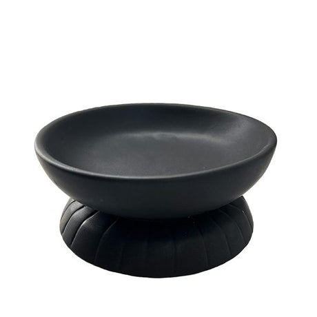 Matt black organic-shaped trinket dish for organizing jewelry and enhancing home decor with modern elegance.