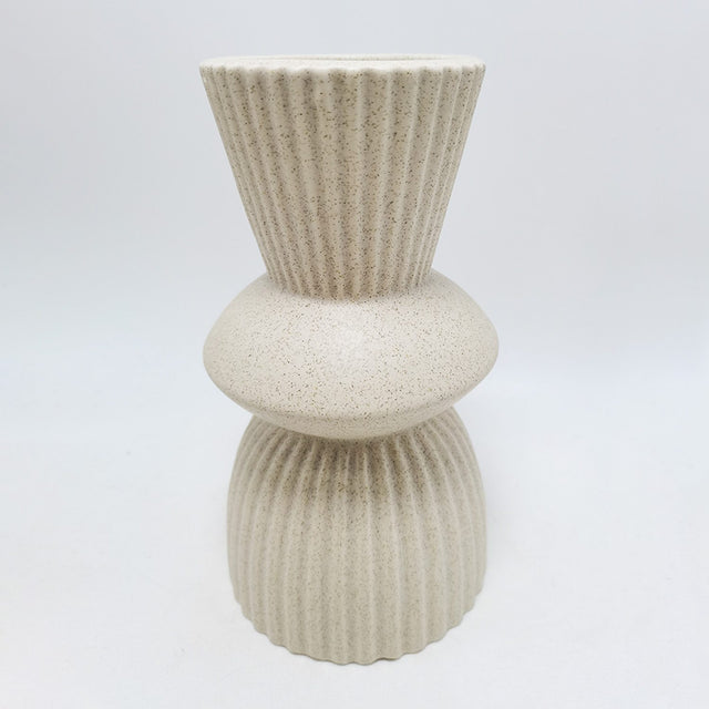 Elegant 11x11x20 cm porcelain vase, perfect for floral displays or as a modern decor piece in any setting.