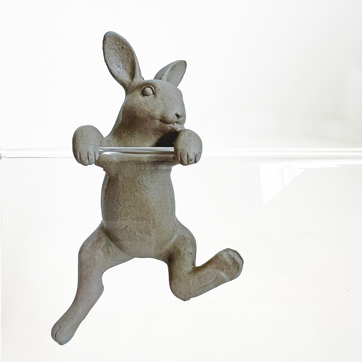 Cute grey rabbit hanging ornament, perfect for adding charm to home or office decor, crafted from durable resin.