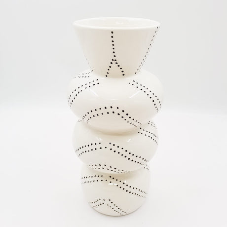 Elegant dolomite vase measuring 12x12x25cm, perfect for modern decor and displaying flowers or greenery.