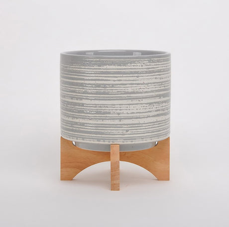 HOOP Medium Planter in Grey with Stand, featuring a speckled design and sturdy wooden legs, perfect for indoor plants.