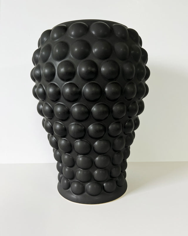 Large black vase with unique matte and gloss finish, perfect for flowers or as a striking decor centerpiece.