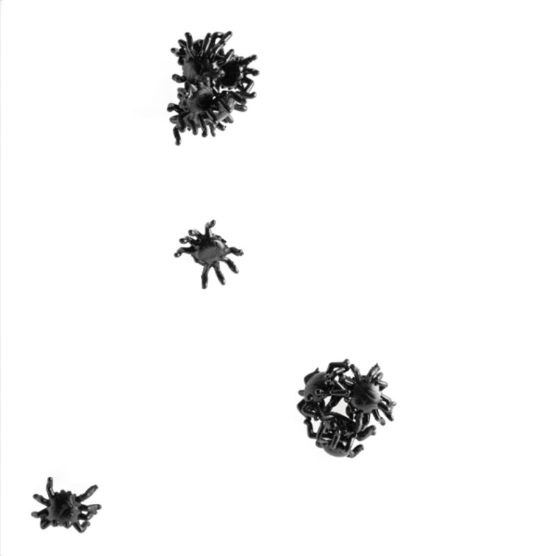 Squishy black spider toys that stick to walls and crawl down, perfect for play or spooky decor, with 20 in each pack.