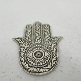 Elegant white metal HAMSA incense holder, 12.3cm tall, combines art and functionality for a tranquil atmosphere.