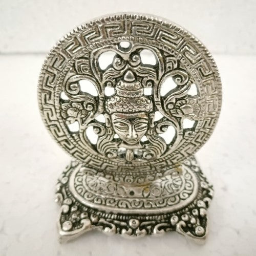 White metal Buddha head incense holder (9cm) with intricate details, perfect for meditation and creating a peaceful ambiance.