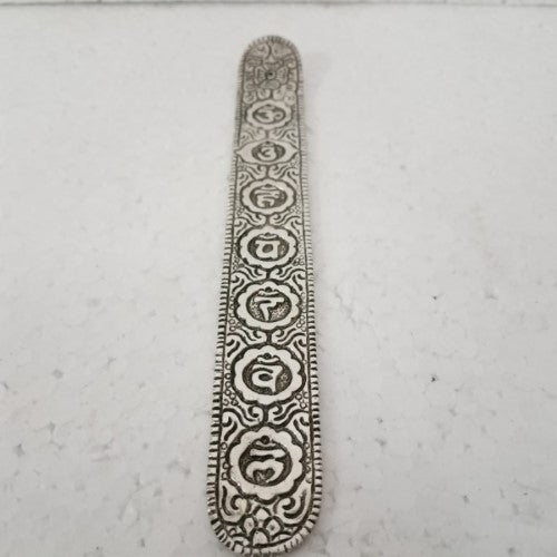 White metal chakra incense holder (23.5cm) with intricate designs, perfect for meditation and enhancing spiritual rituals.