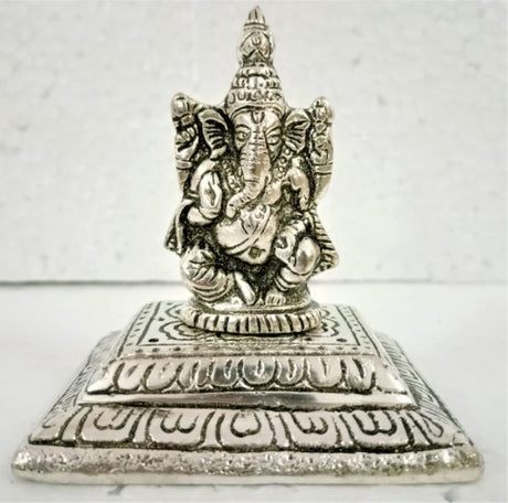 Elegant white metal Ganesha incense holder, 10.5cm, promoting peace and spirituality in your home decor.