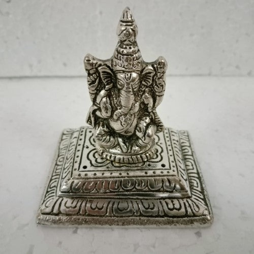 White metal square incense holder with intricately designed Ganesha, promoting peace and spirituality in any space.