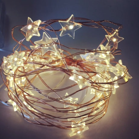 Copper fairy lights with 50 warm white LEDs on a flexible 5-meter wire, perfect for indoor decoration and ambiance.