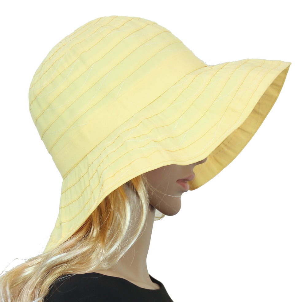 Bright lemon ribbon Breton hat with adjustable drawstring and UPF 50+ sun protection, perfect for summer outings.