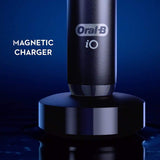 Braun Oral-B iO Series 7 electric toothbrush in Black Onyx with AI recognition, pressure sensor, and round brush head design.