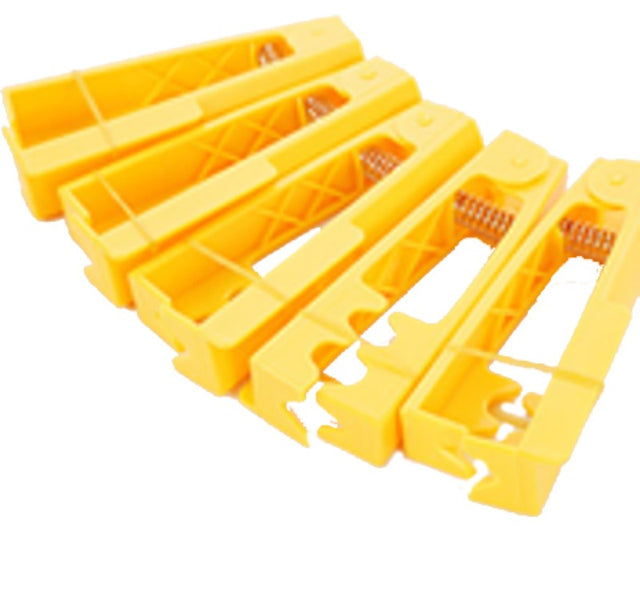 Bright yellow plastic rose stripper for easy removal of thorns and leaves, enhancing floral design efficiency.