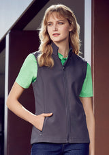 Ladies Apex Vest in Navy, Size S with stand-up collar, fleece lining, water-repellent fabric, and scalloped back design.