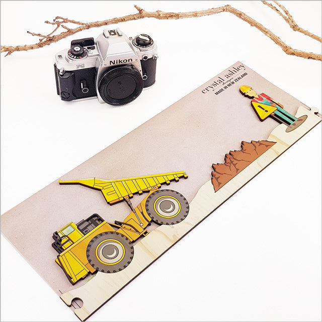 Eco-friendly pine veneer wall art featuring fun puzzle pieces of a construction site, perfect for children's spaces.