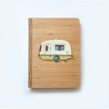 Eco-friendly bamboo journal featuring a kiwi and ant design, perfect for notes and sketches, with replaceable A5 notebook.
