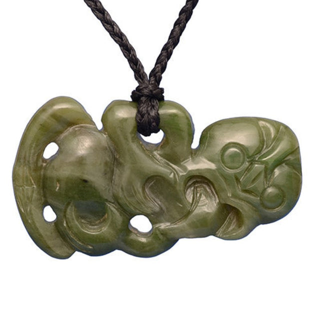 Medium-sized Jade Tiki pendant, hand-carved from Nephrite Jade, symbolizes fertility and good luck on an adjustable black cord.