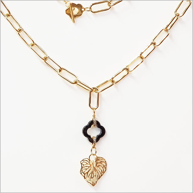 KC gold plated paperclip chain necklace featuring a nature-inspired Kawakawa leaf charm, perfect for any occasion.