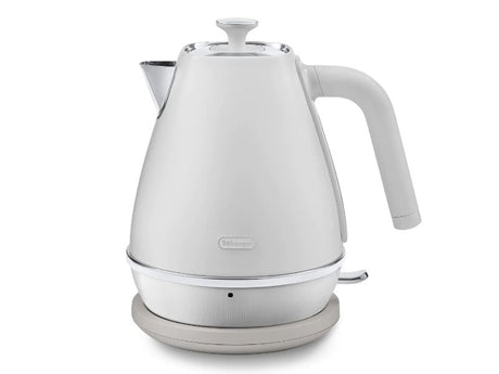 DeLonghi Distinta Moments Kettle in white with sleek metallic finish, 1.7L capacity, and 360° swivel base for cordless use.