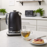 Sleek black Sunbeam Alinea™ Select kettle with 1.7L capacity, temperature control, and 360° cordless base for effortless brewing.